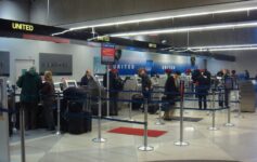 people standing in a line at an airport
