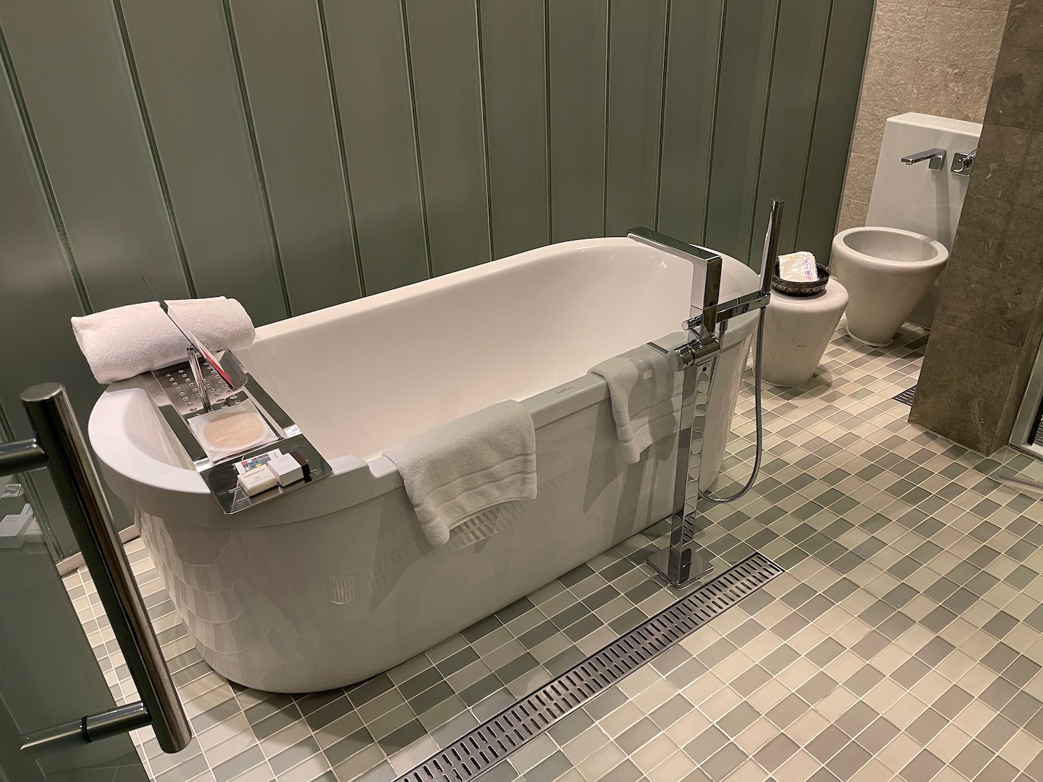 a bathtub and toilet in a bathroom