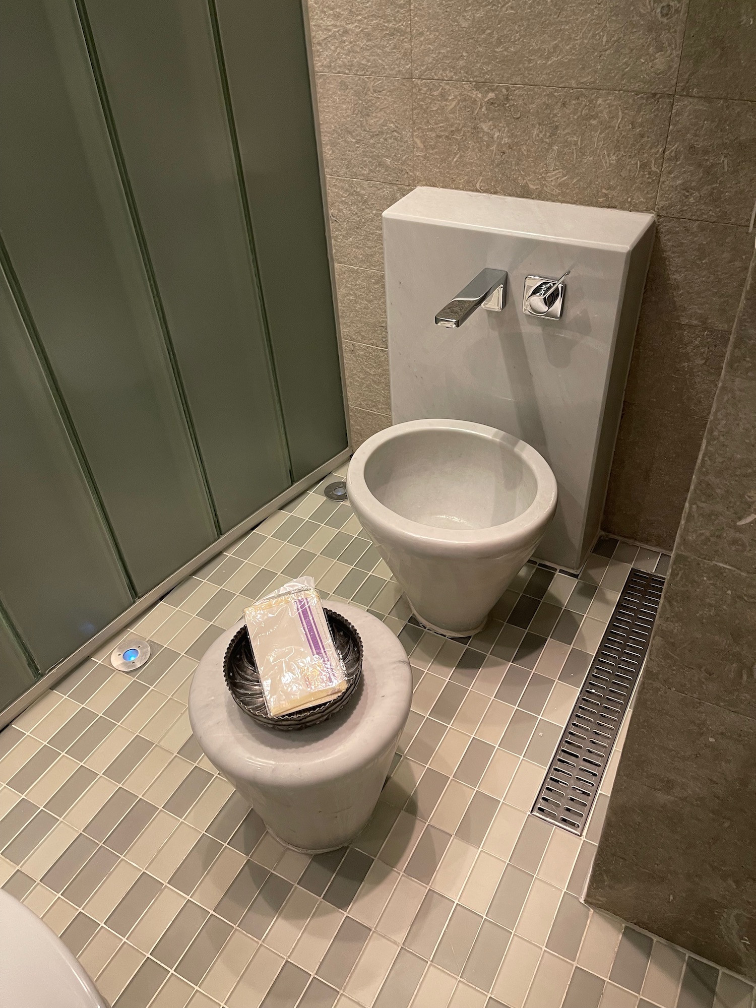 a toilet and a sink in a bathroom