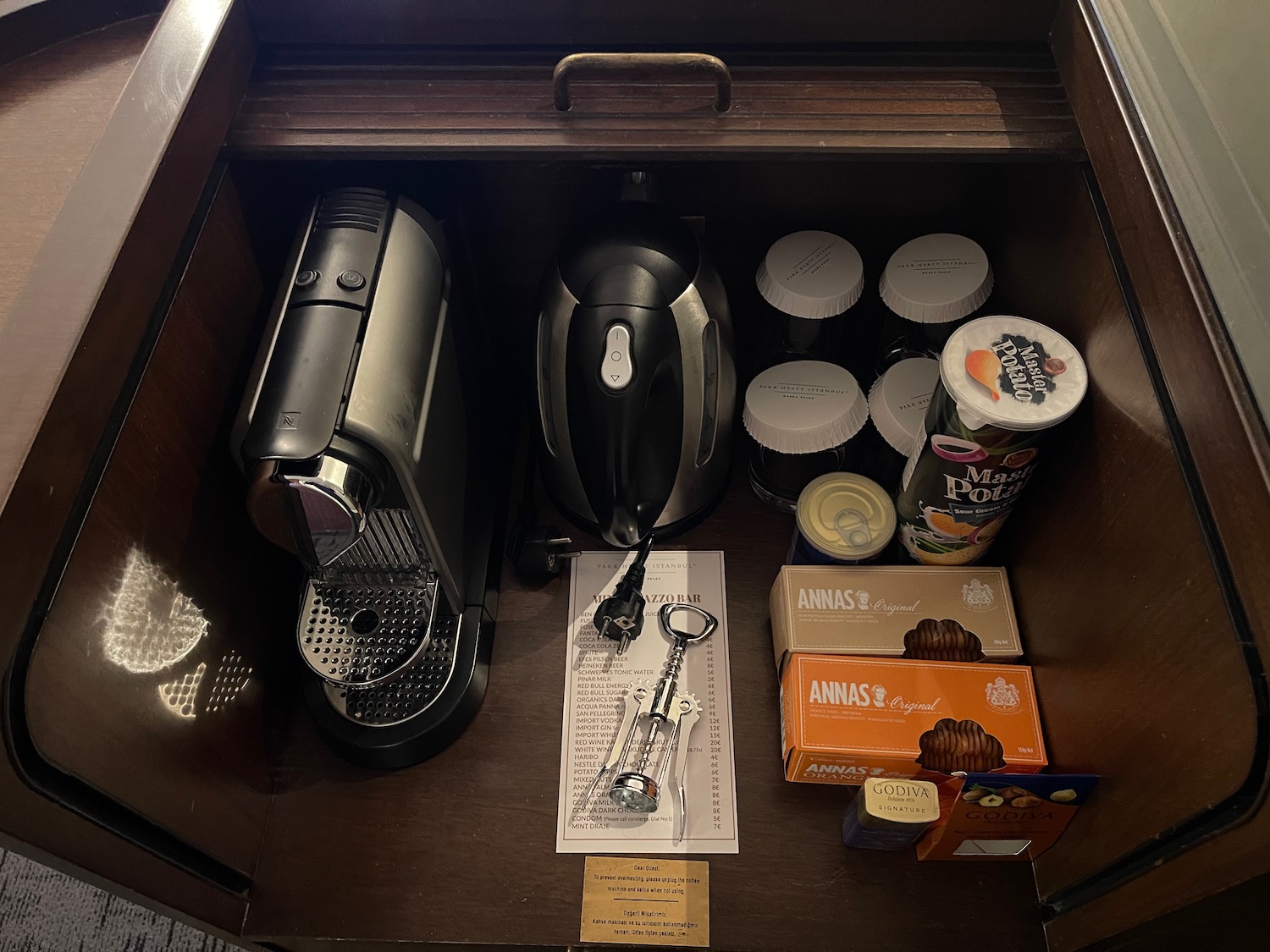 a coffee machine and other items in a drawer