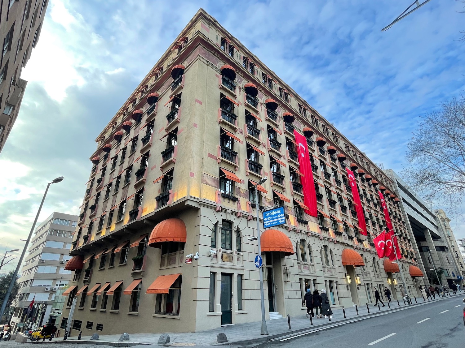 a building with many windows and a street sign