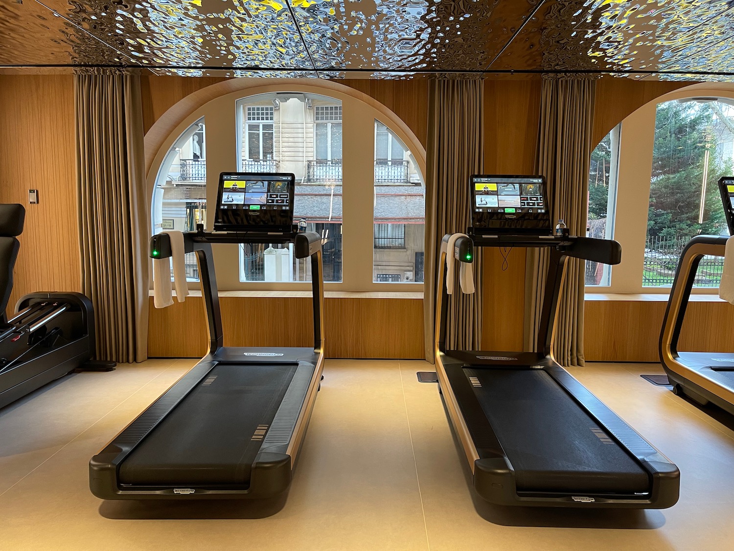 tread treadmills in a room with windows