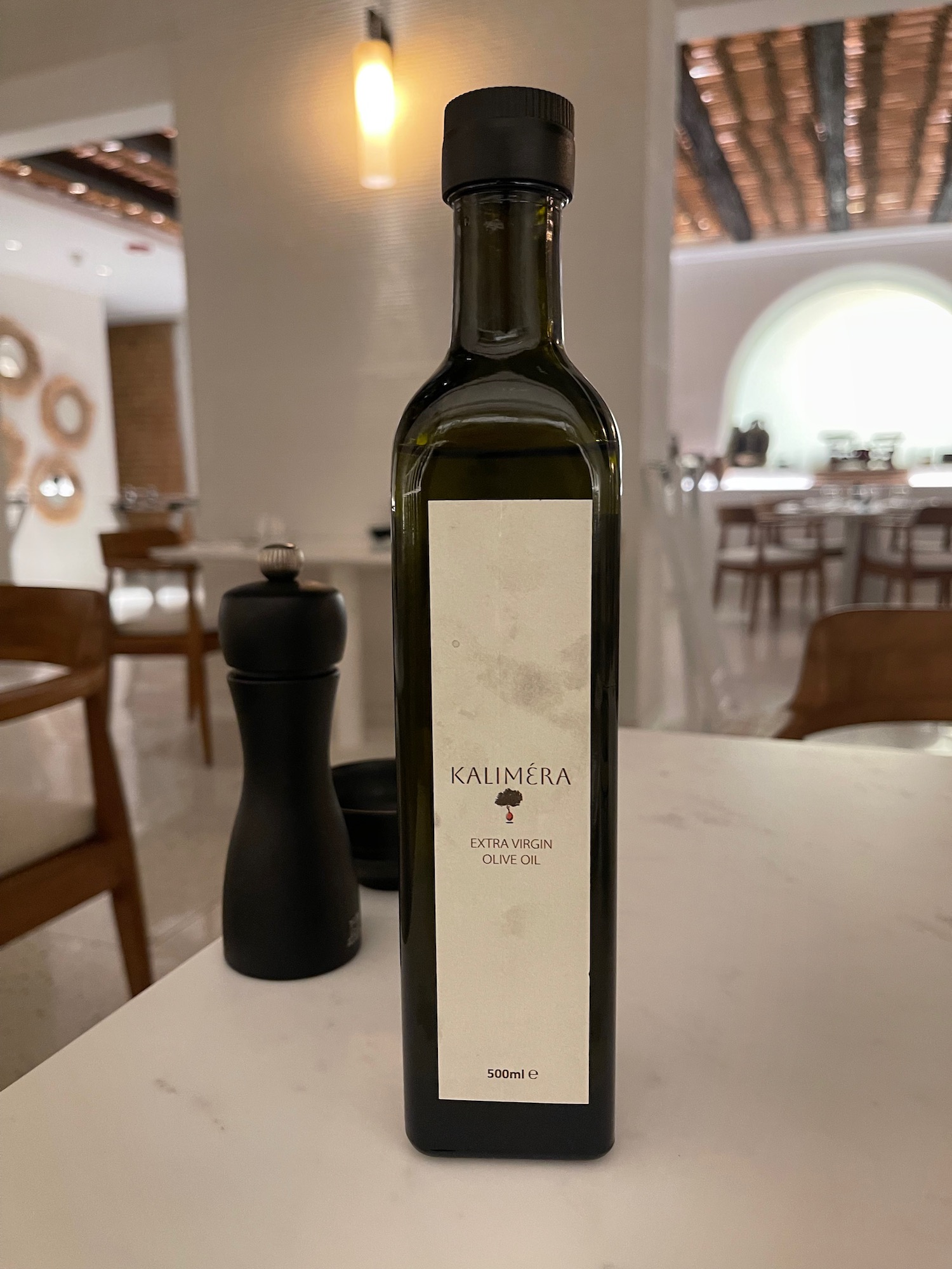 a bottle of olive oil on a table