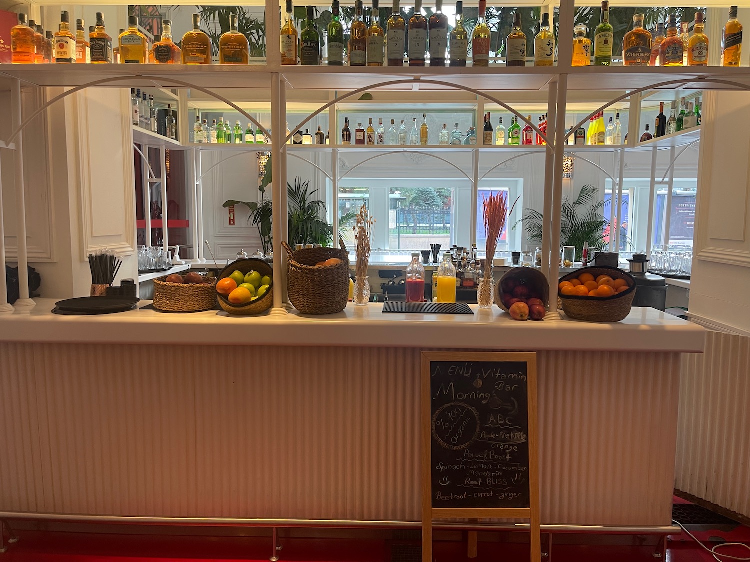 a bar with bottles of alcohol on the counter