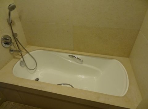 a bathtub with a shower head