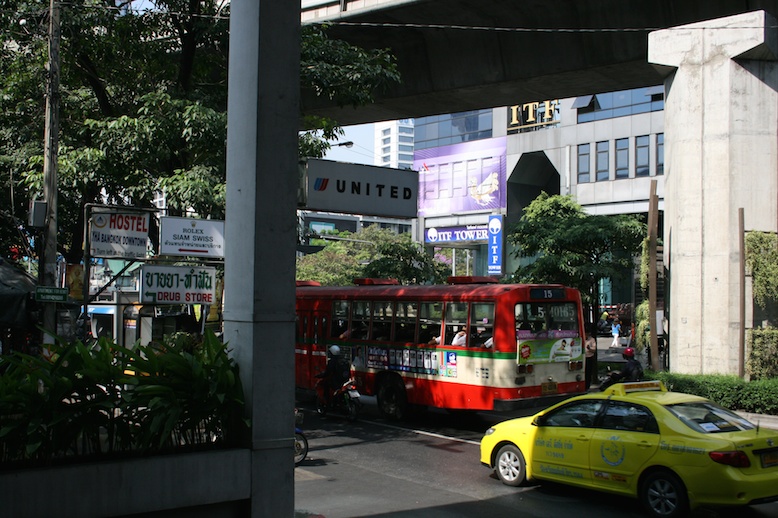 a bus and taxi on the street