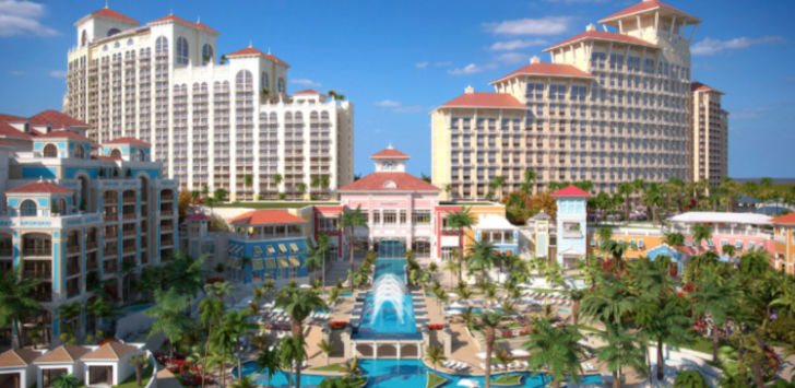 a resort with a pool and palm trees