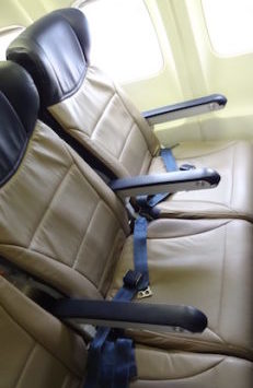 a seat belt on a plane