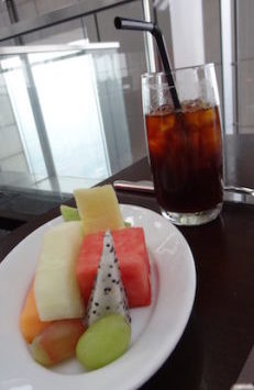 a plate of fruit and a drink