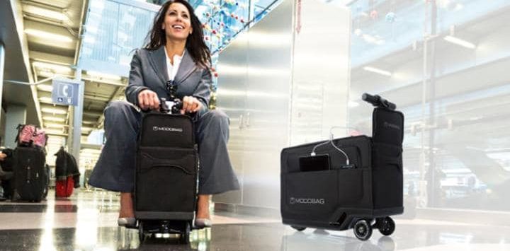 a woman sitting on a luggage cart