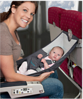 a woman holding a baby in a car seat