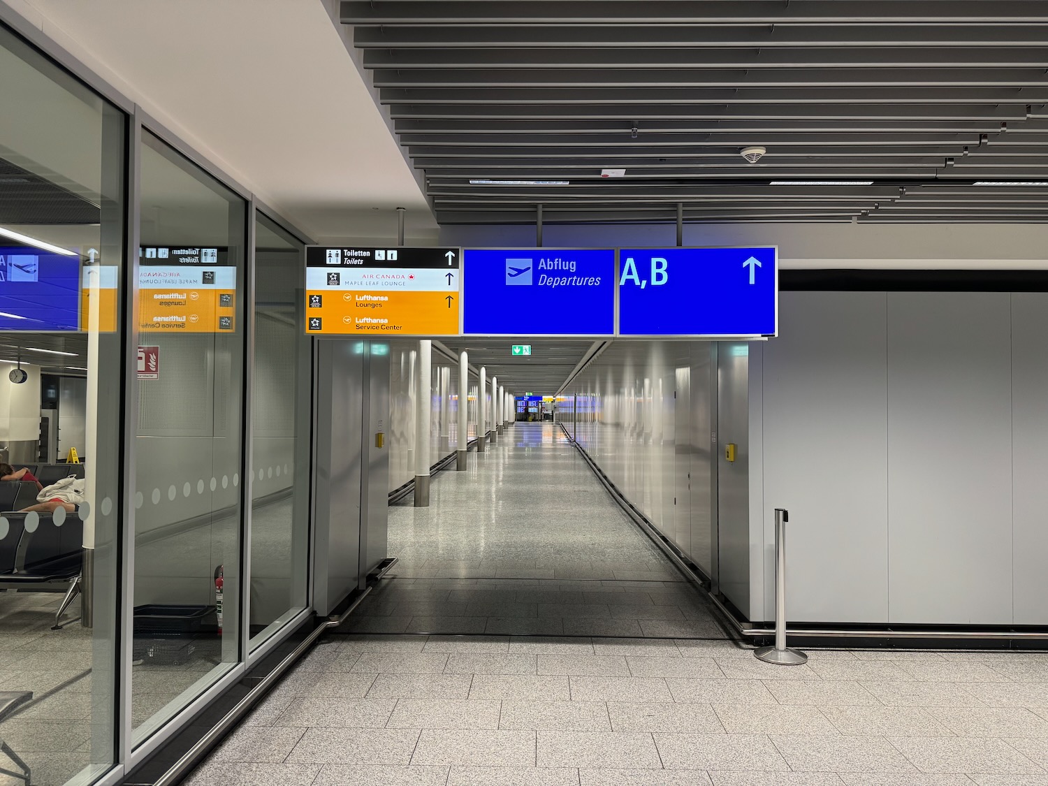a hallway with signs and a door