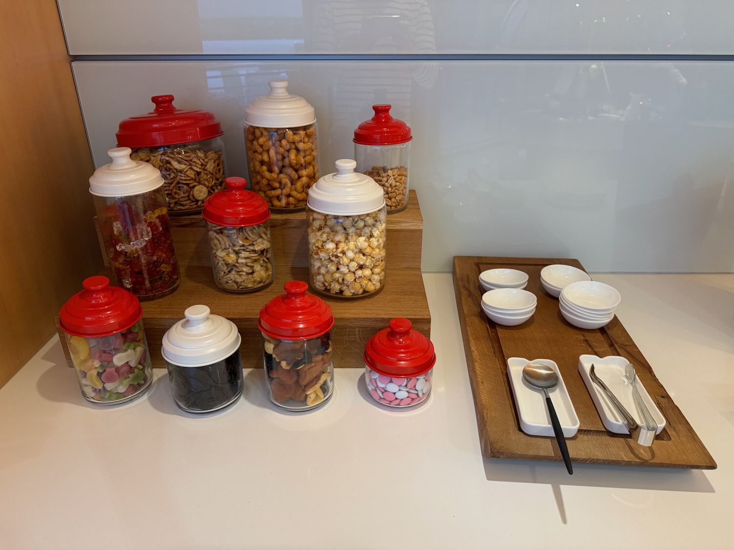 a group of containers with red lids on a counter