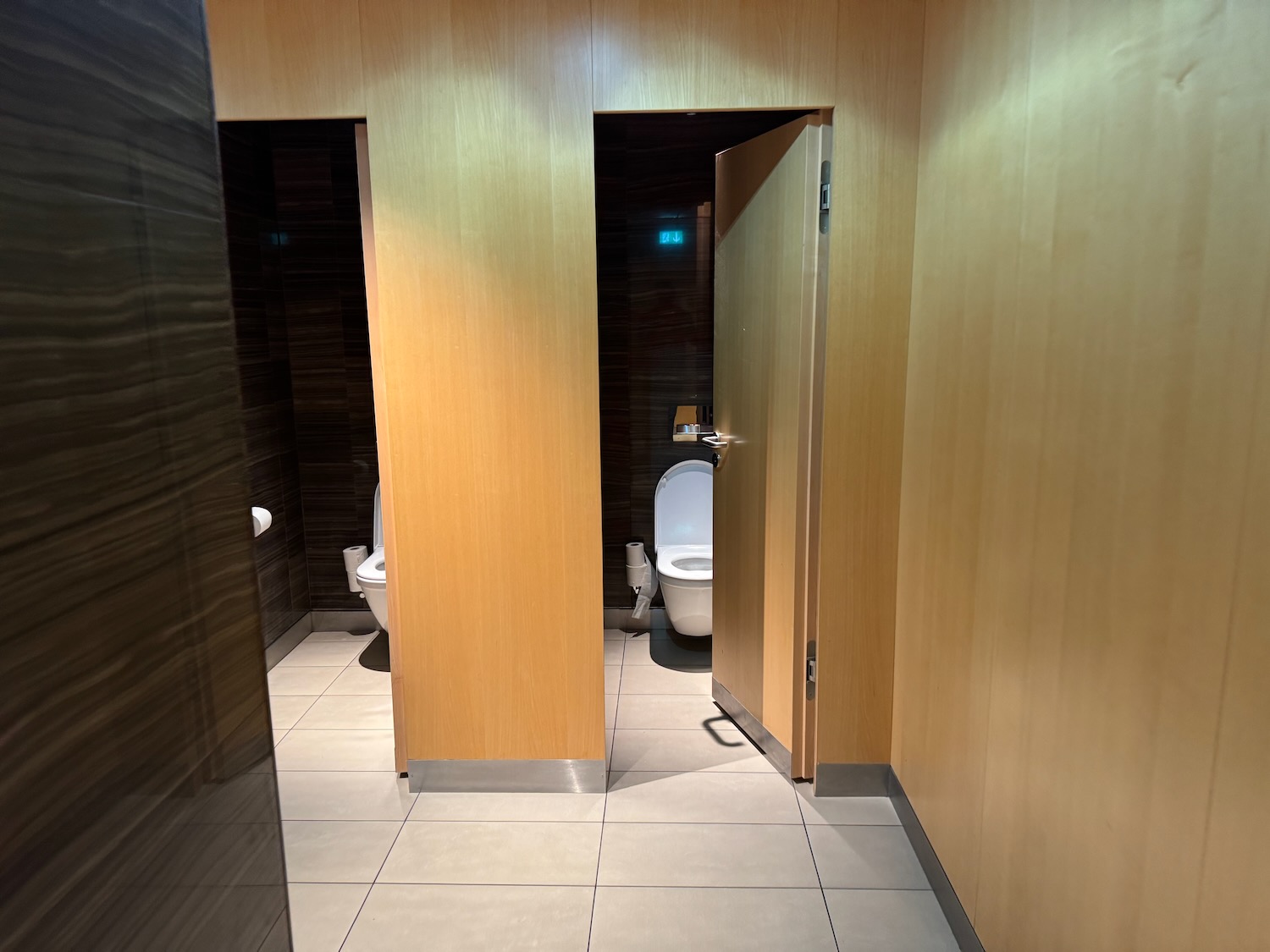 a bathroom with a door open