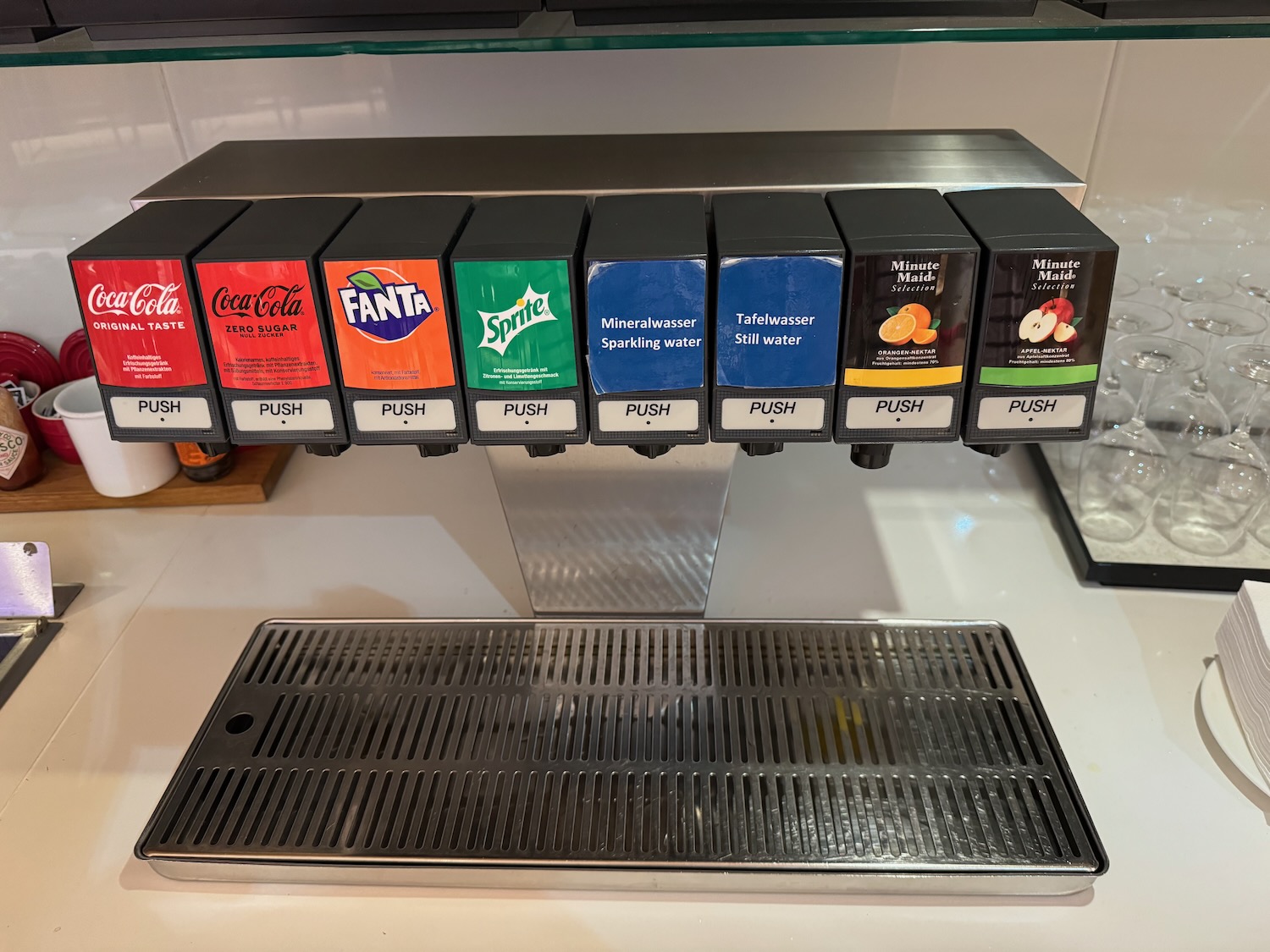 a group of soda dispensers