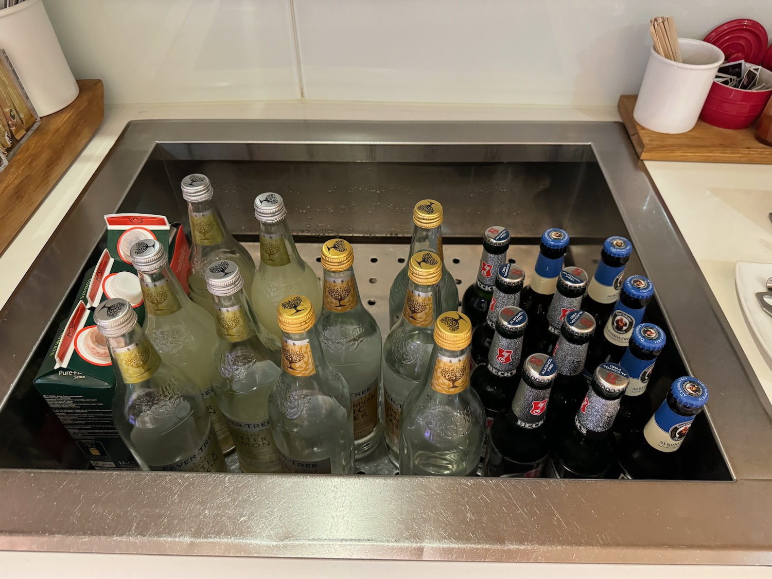 a sink full of bottles