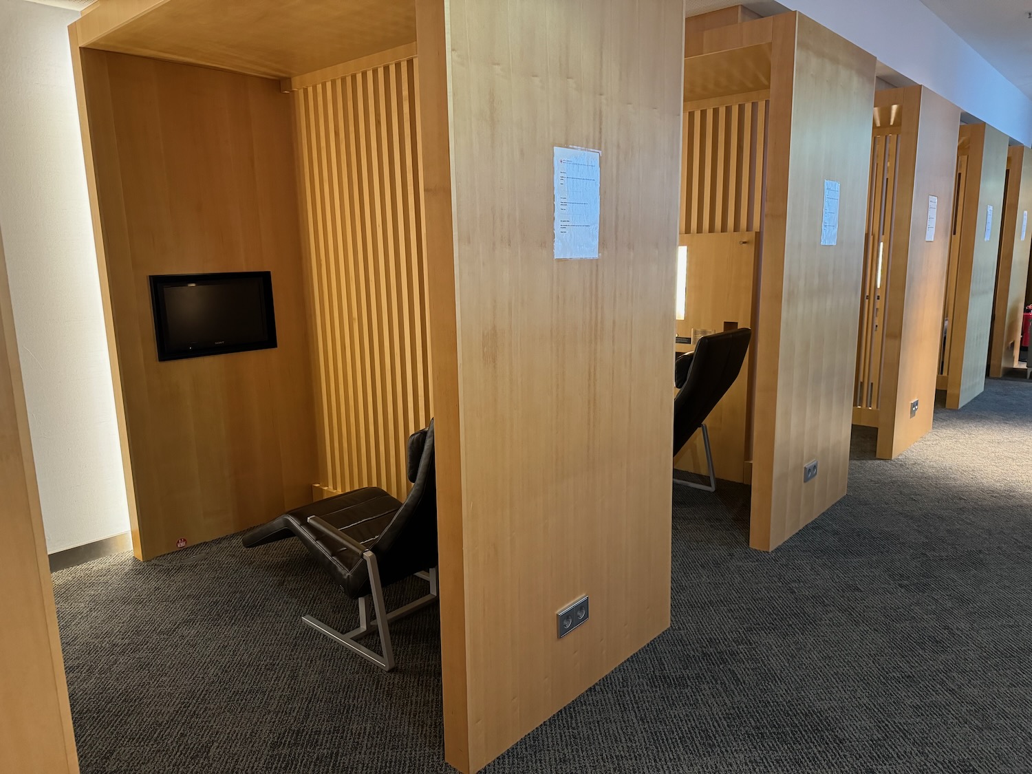 a room with a tv and a chair