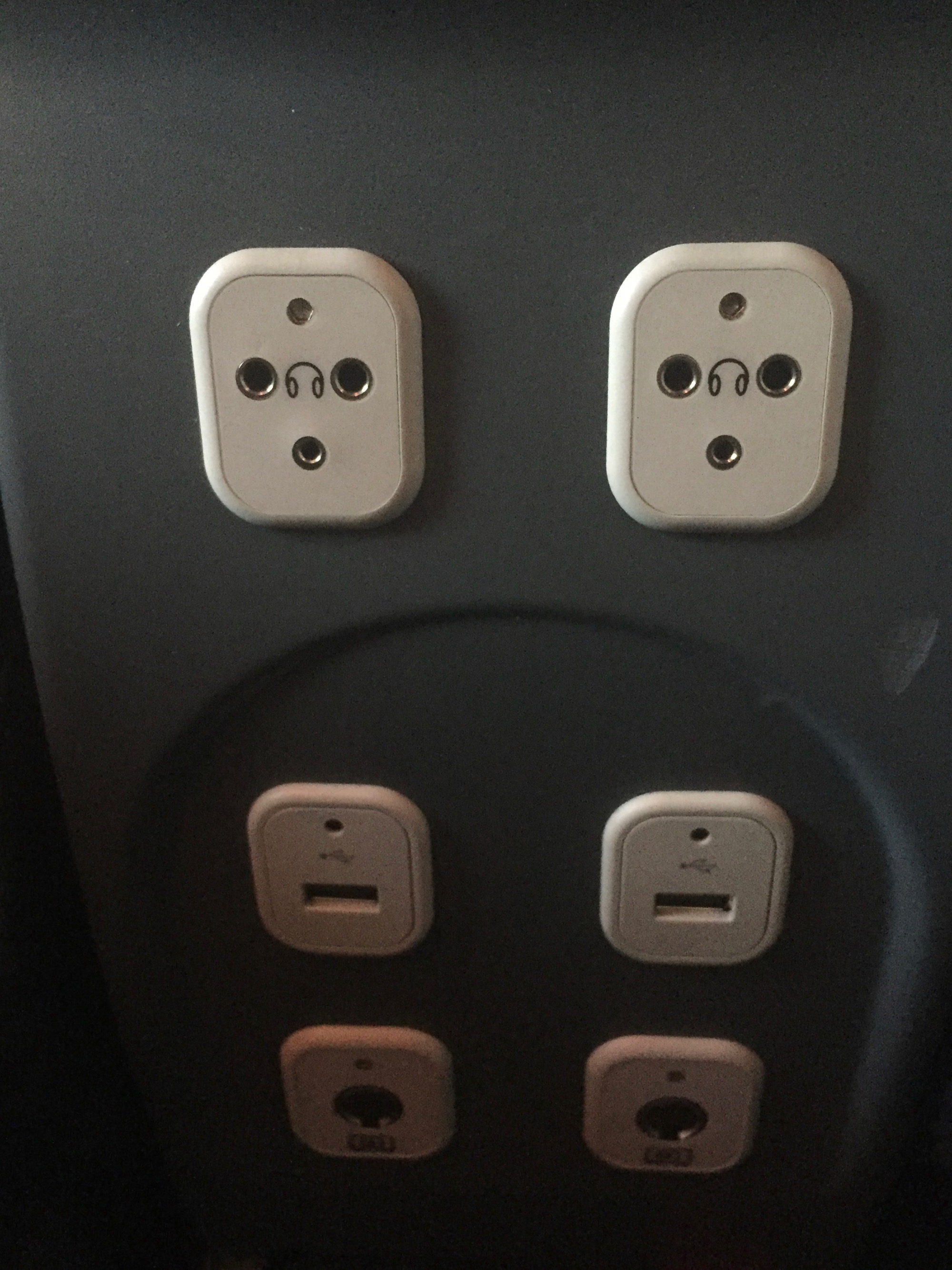 a group of plugs on a wall