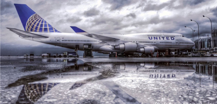 a large airplane on a wet runway