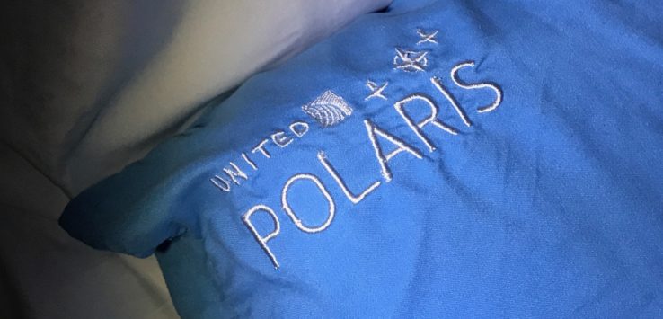 a blue pillow with white text on it
