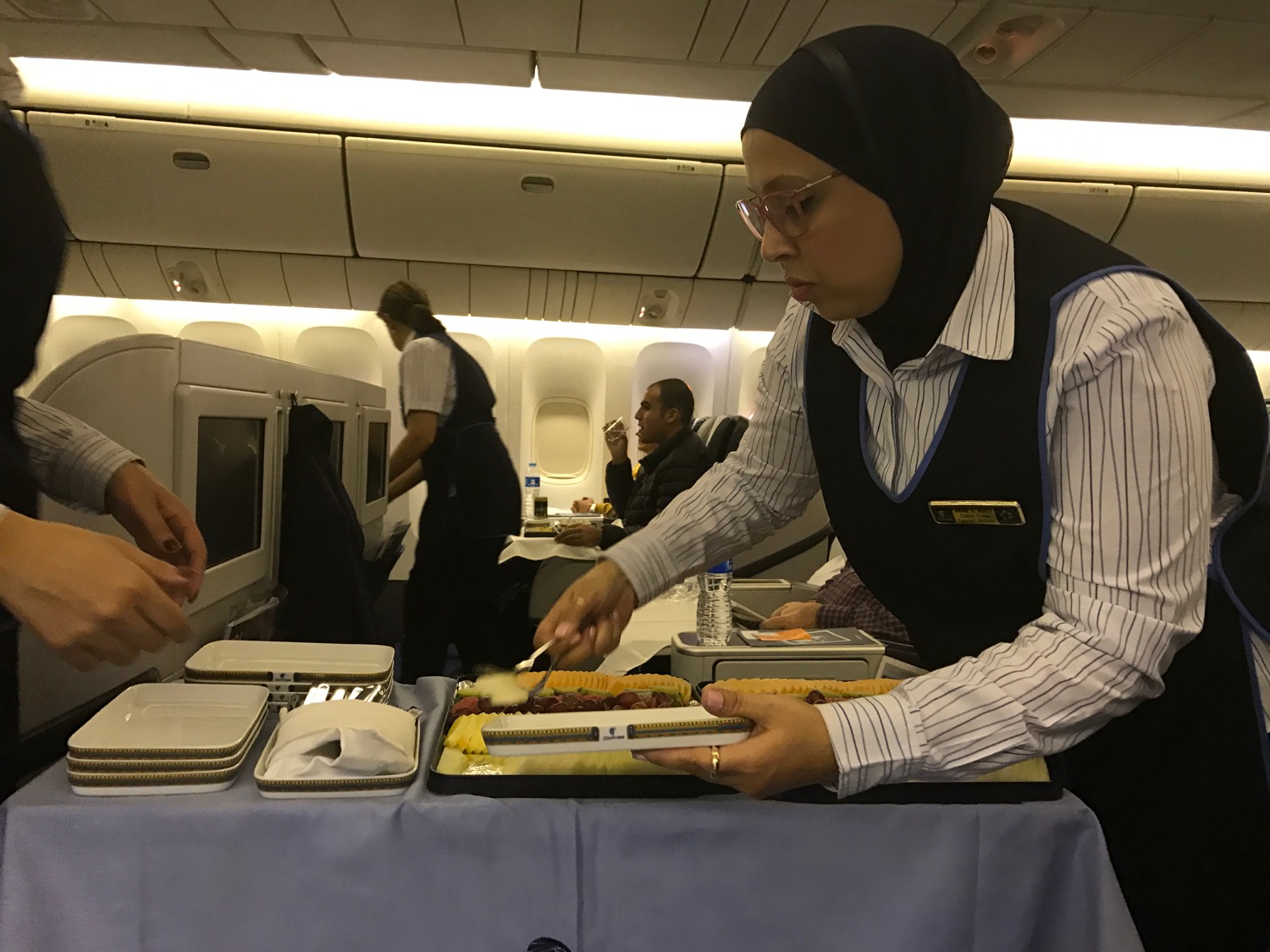 a woman serving food on a table