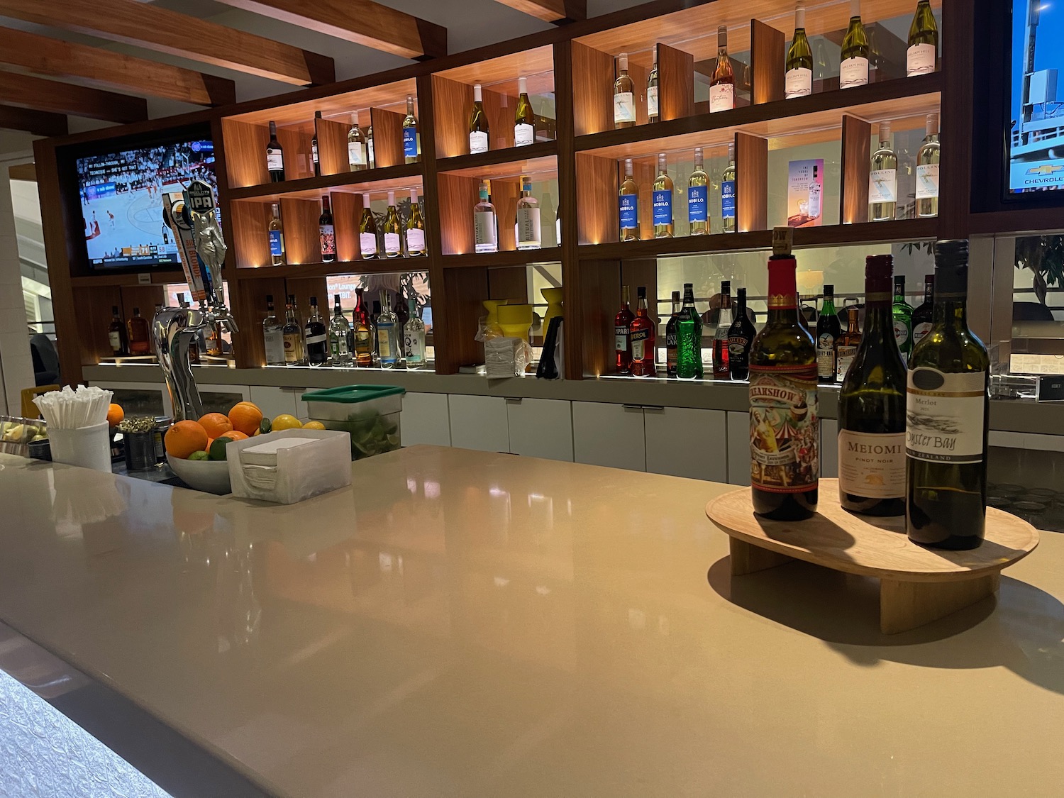 a bar with bottles of alcohol on the counter