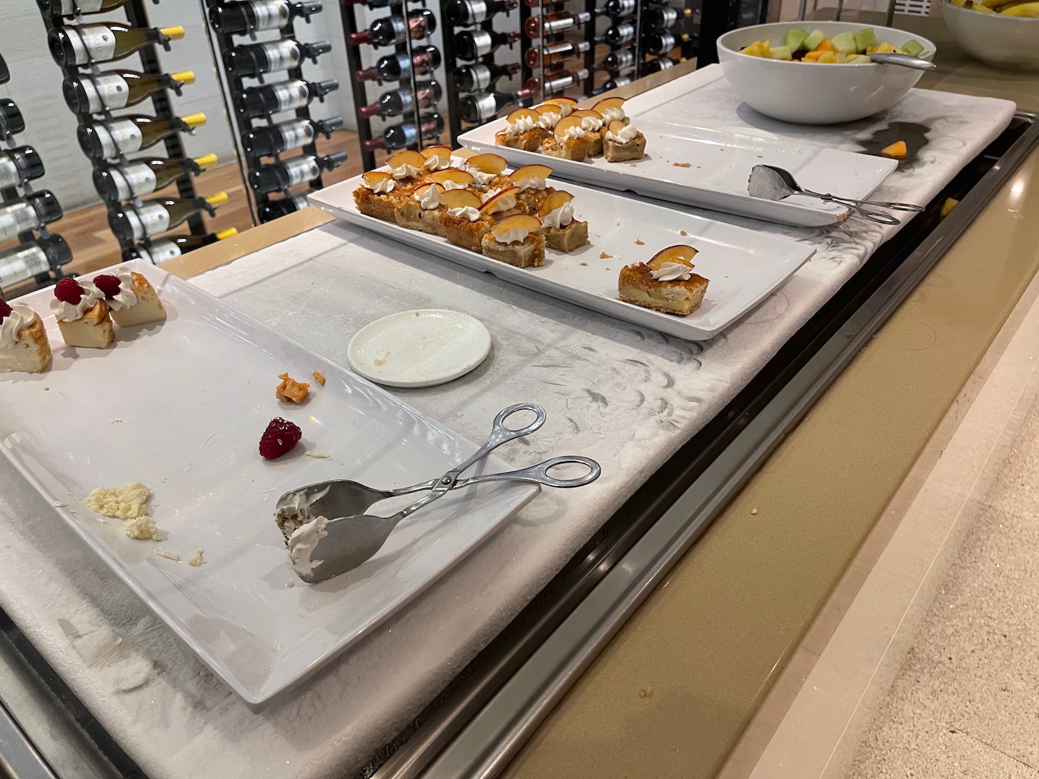 a table with plates of food and utensils