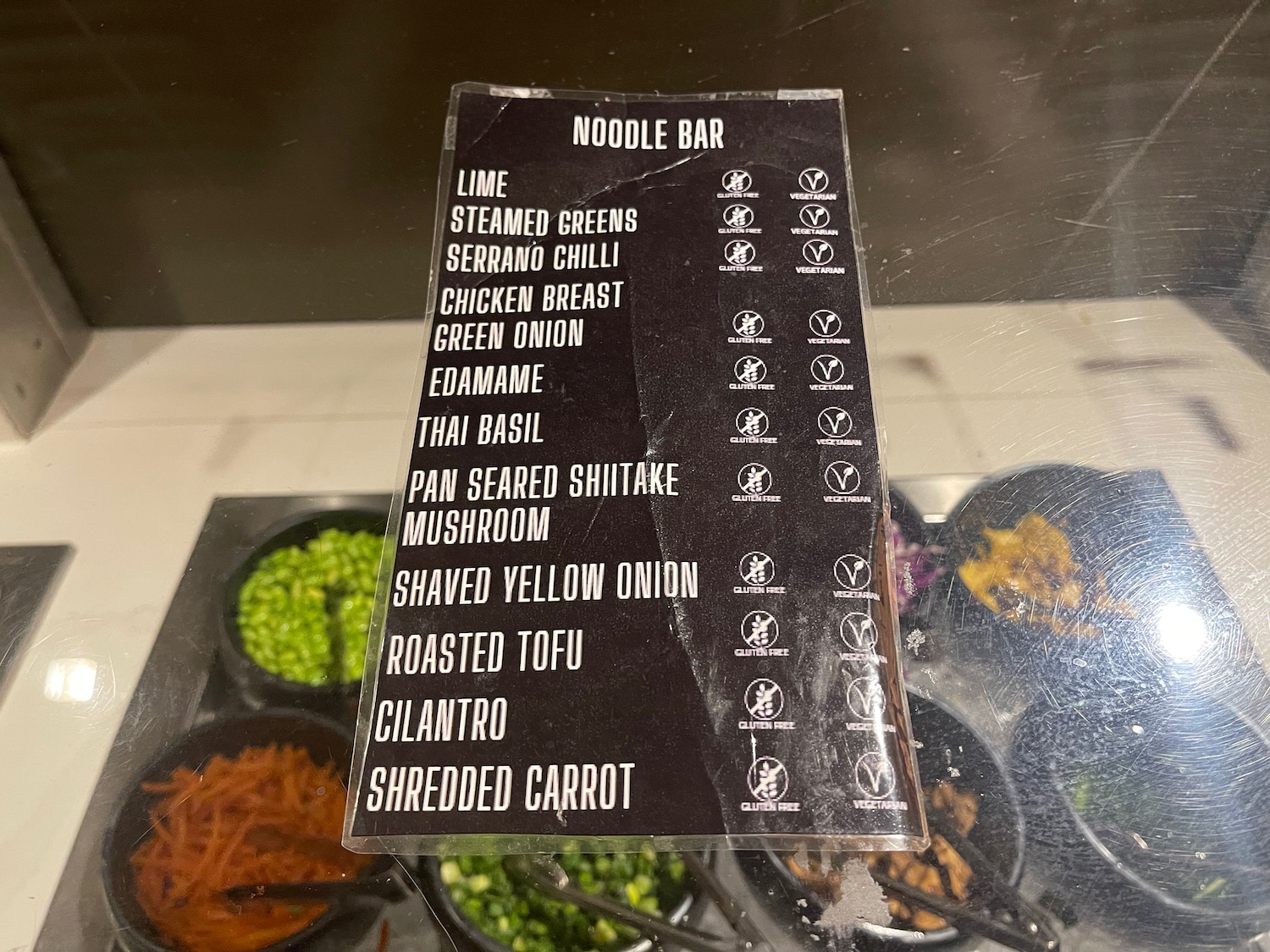 a menu on a glass shelf