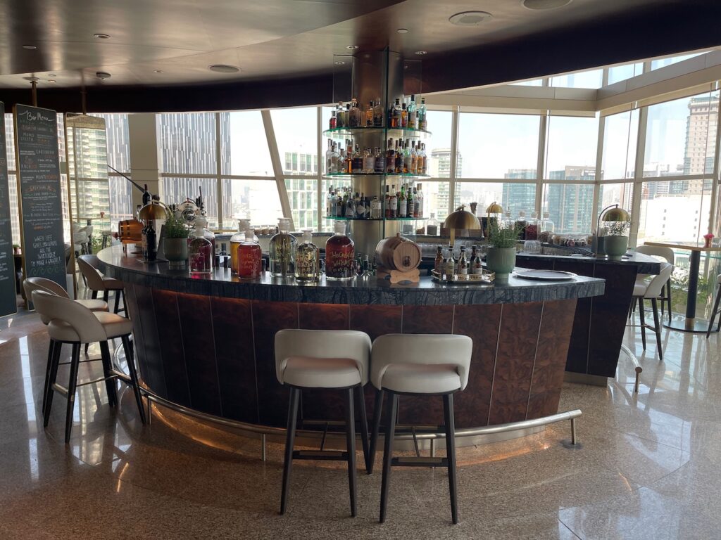 a bar with a shelf of liquor