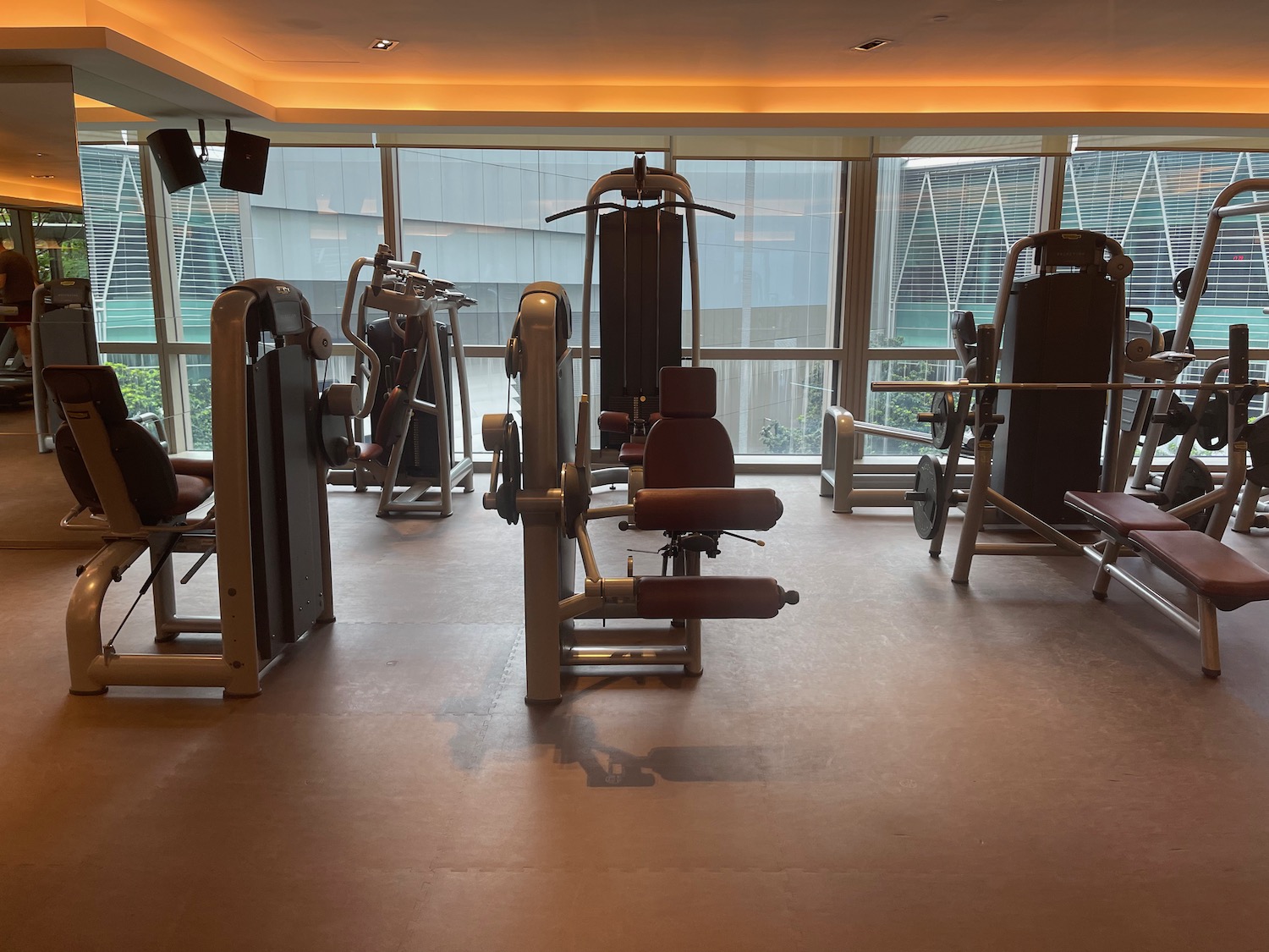 a room with several exercise equipment