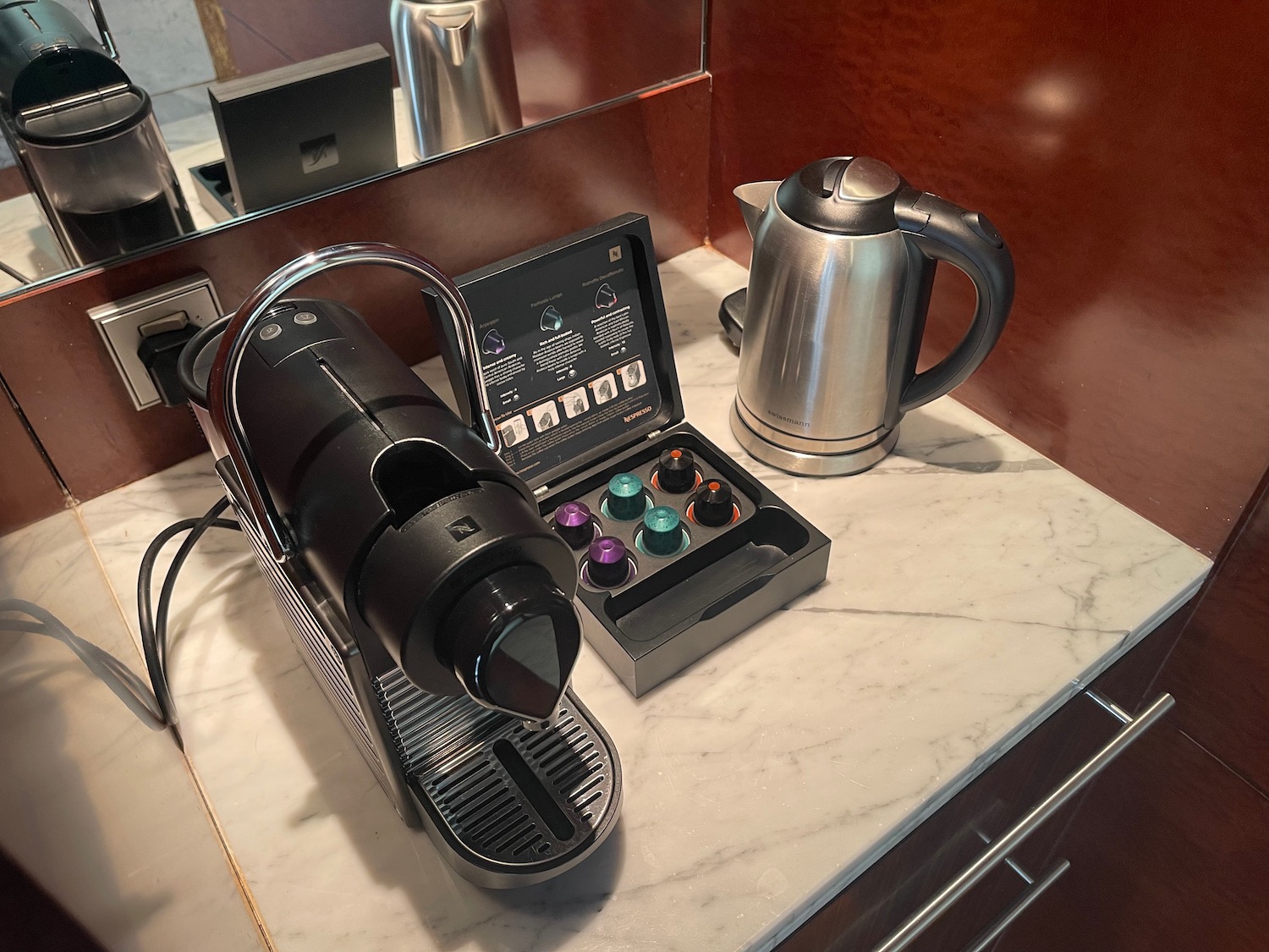 a coffee machine and coffee pot on a counter