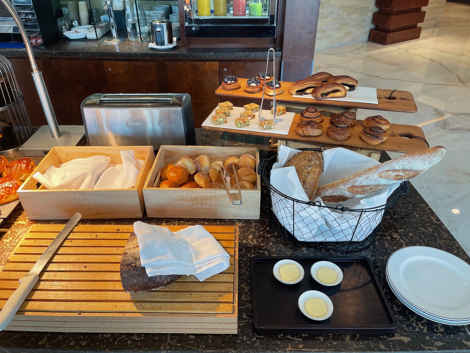 a table with different types of bread and pastries