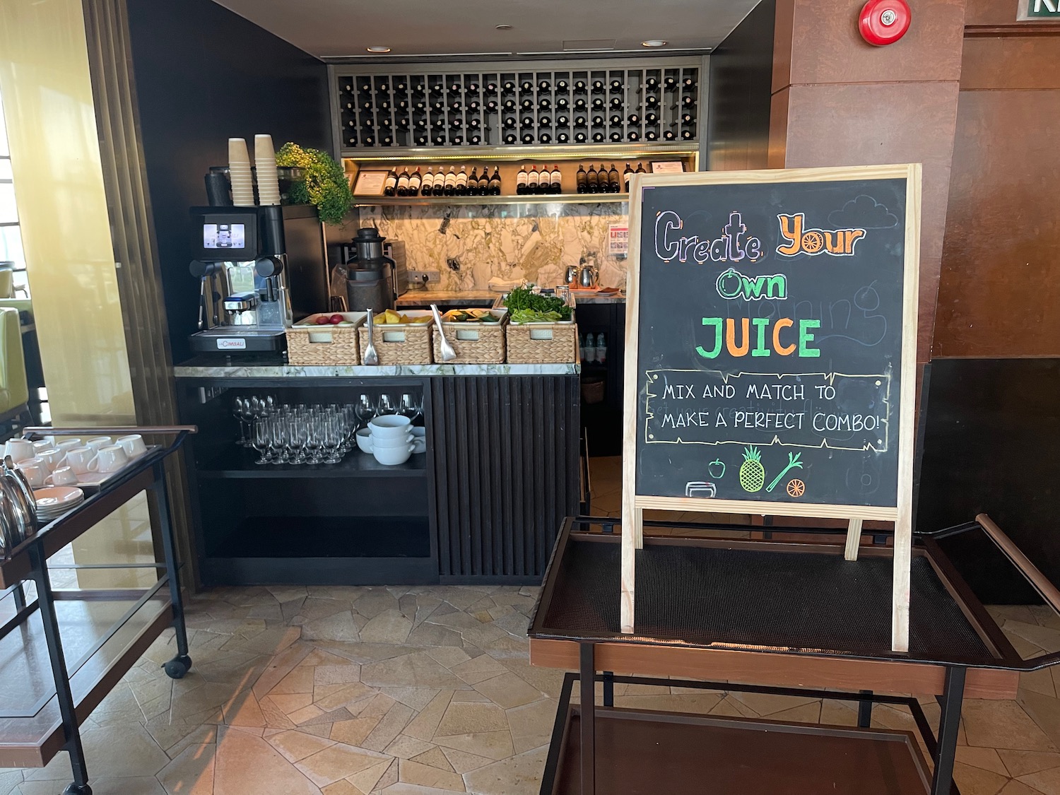 a black board with a sign in front of a counter
