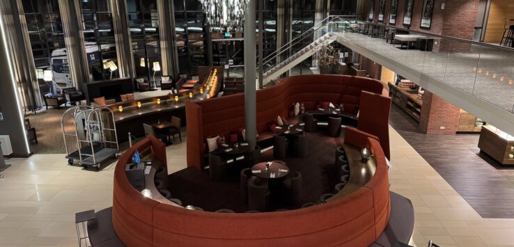 a large room with a round table and chairs