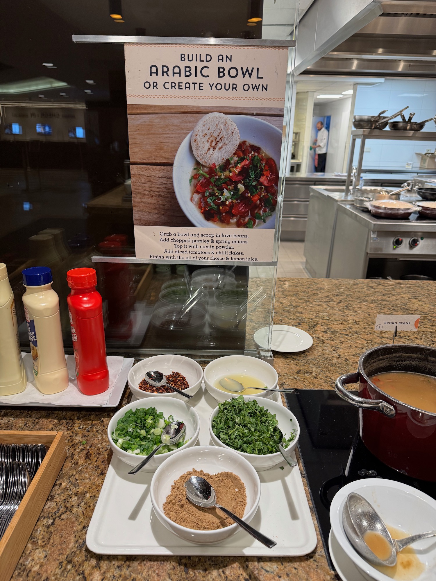 a counter with bowls of food on it