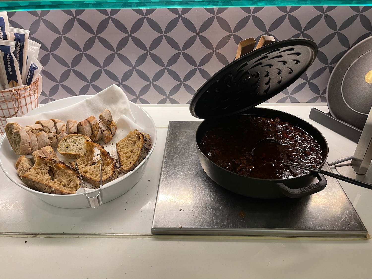 a bowl of food next to a pan of food