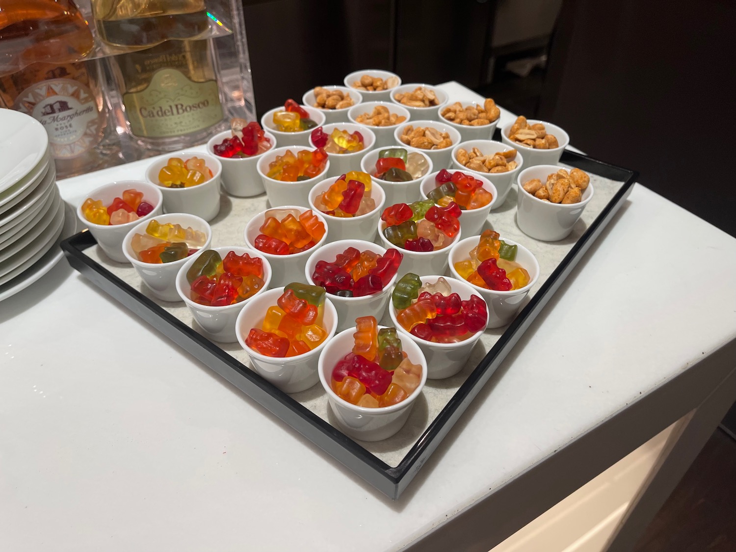 a tray of gummy bears and nuts