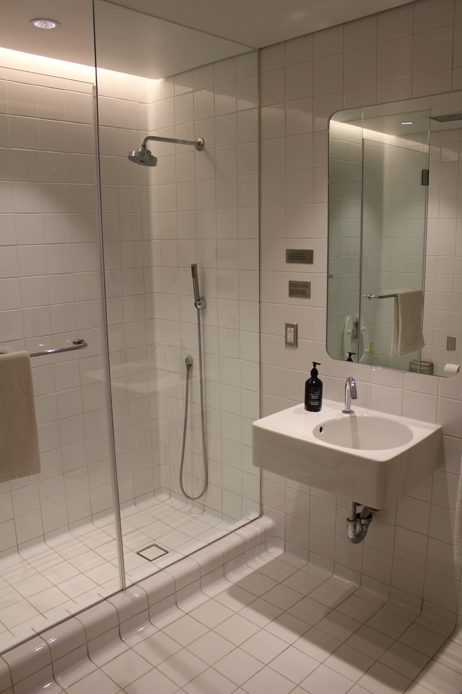 a bathroom with a shower and sink