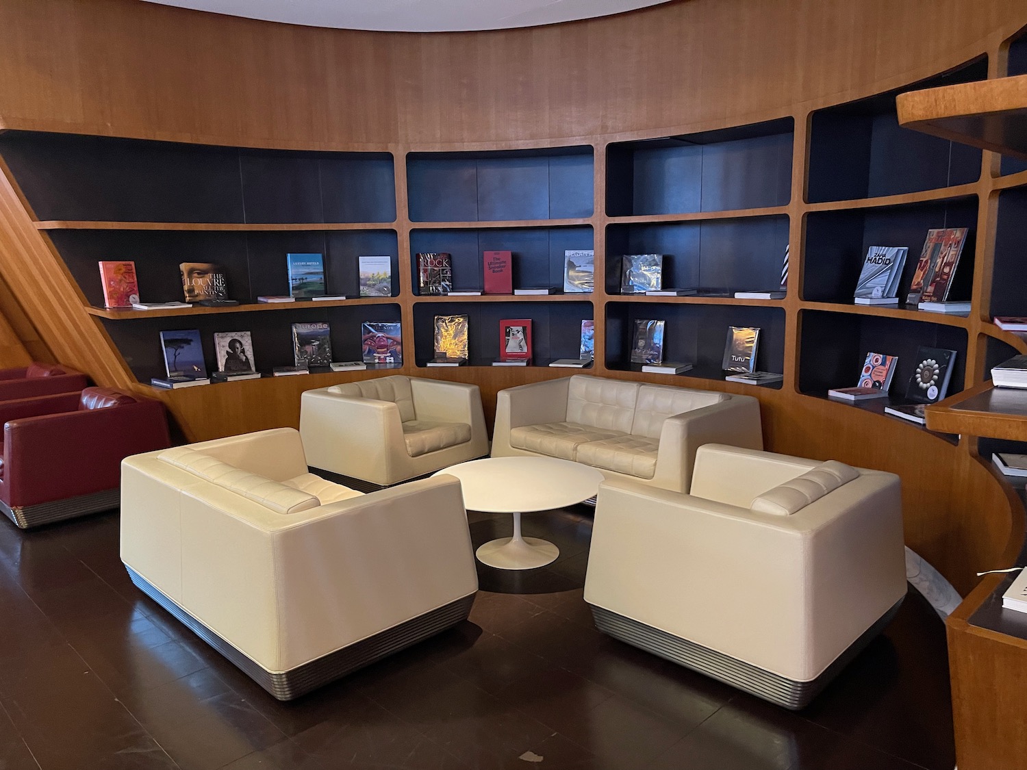 a room with a round table and chairs