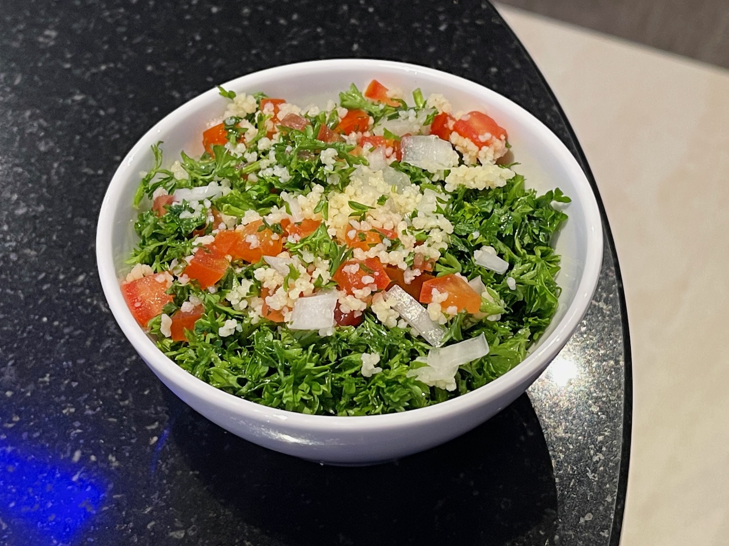 a bowl of salad on a counter