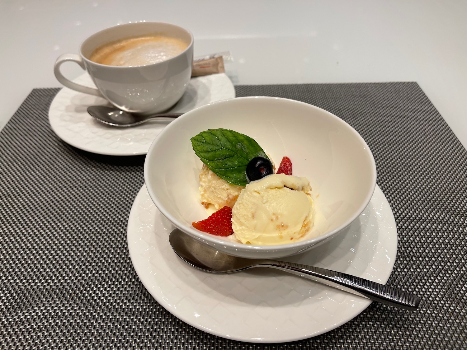 a bowl of ice cream and a cup of coffee