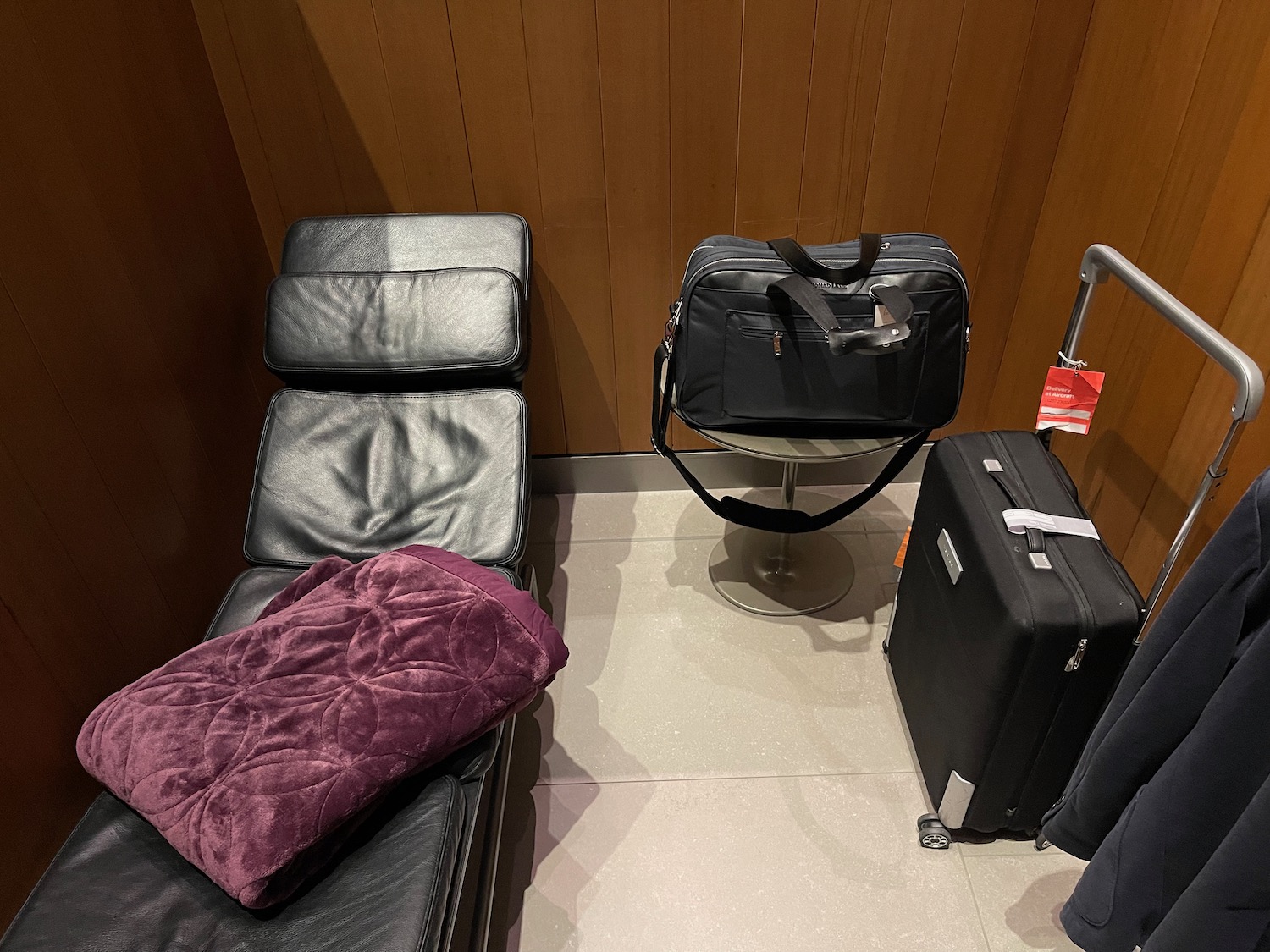 a chair and luggage in a room