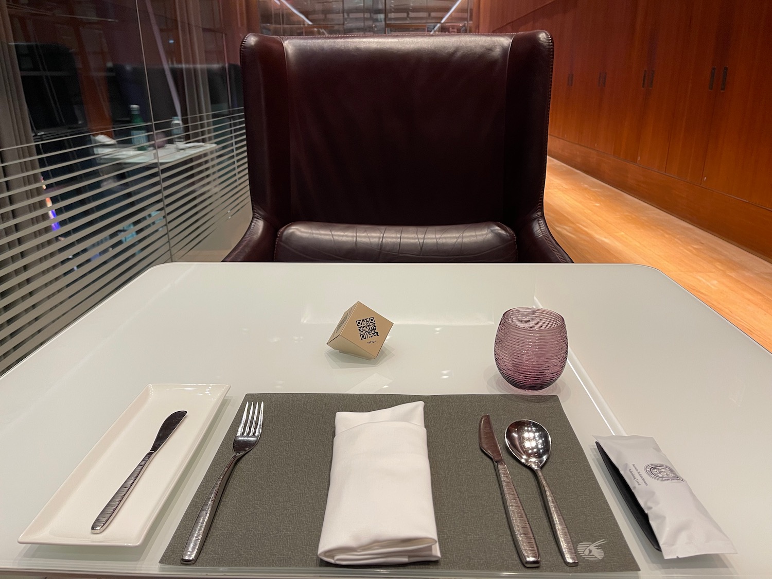 a table with a silverware and a napkin on it