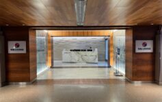 a lobby with a marble counter and a wood ceiling