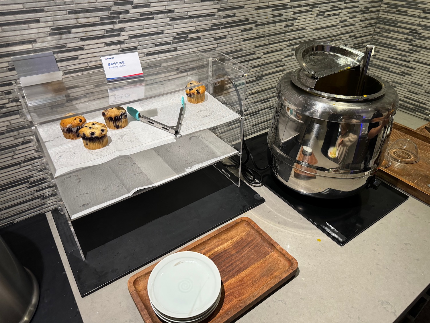 a tray with muffins on it next to a metal container