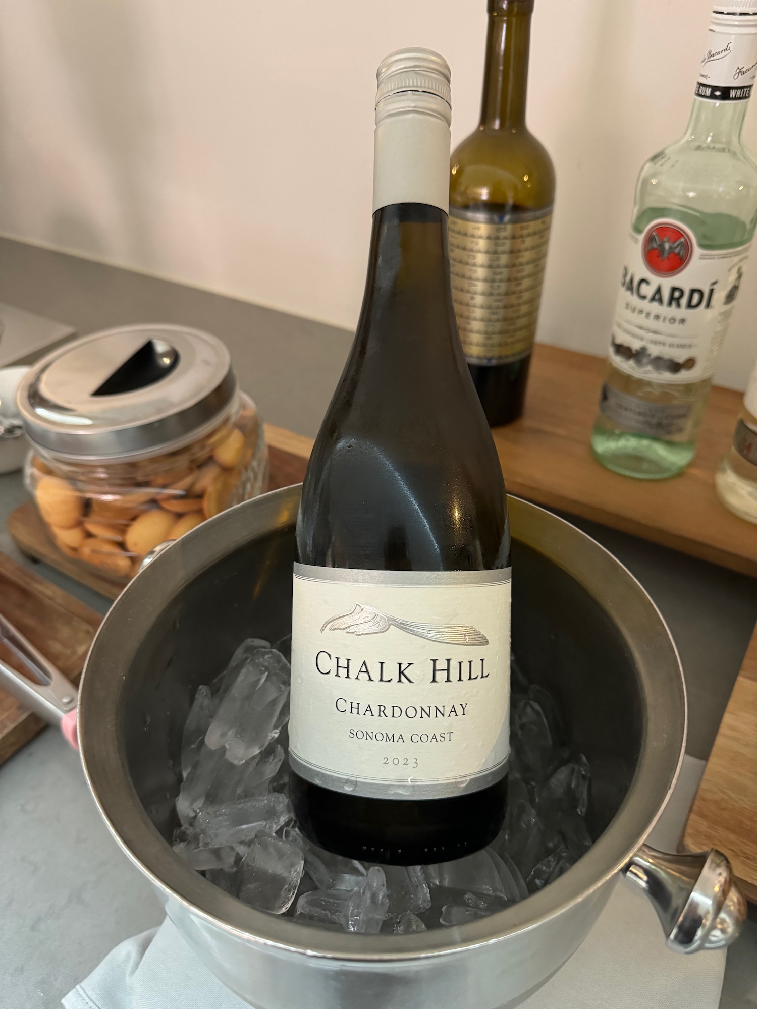 a bottle of wine in a bucket of ice