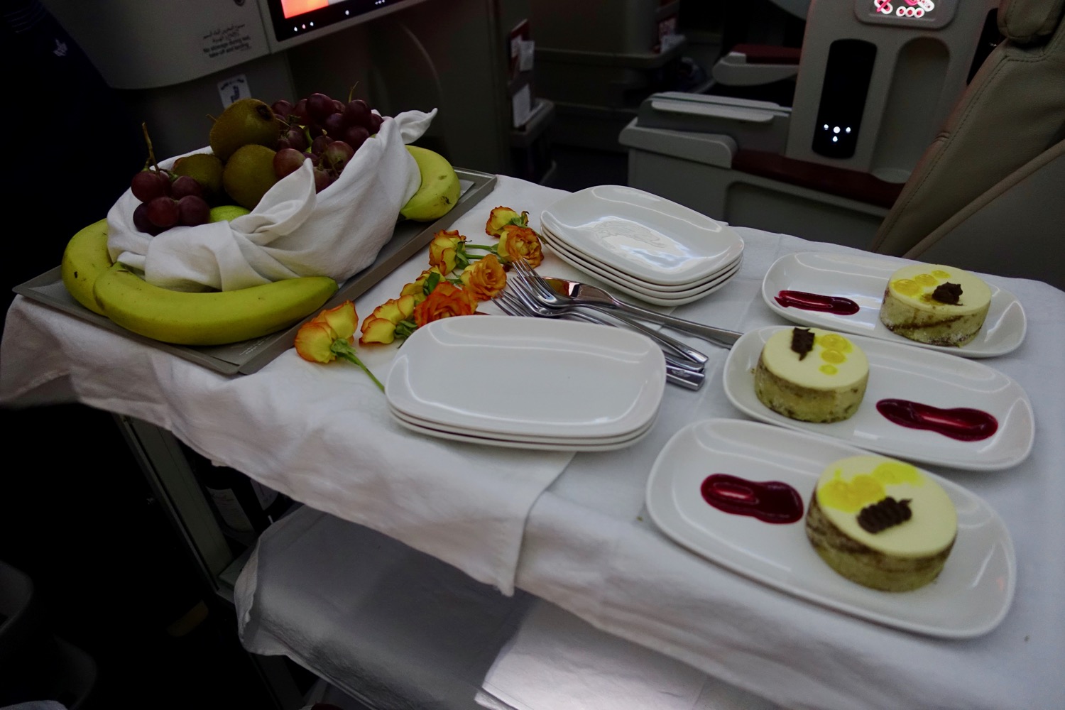 a table with plates and fruit on it