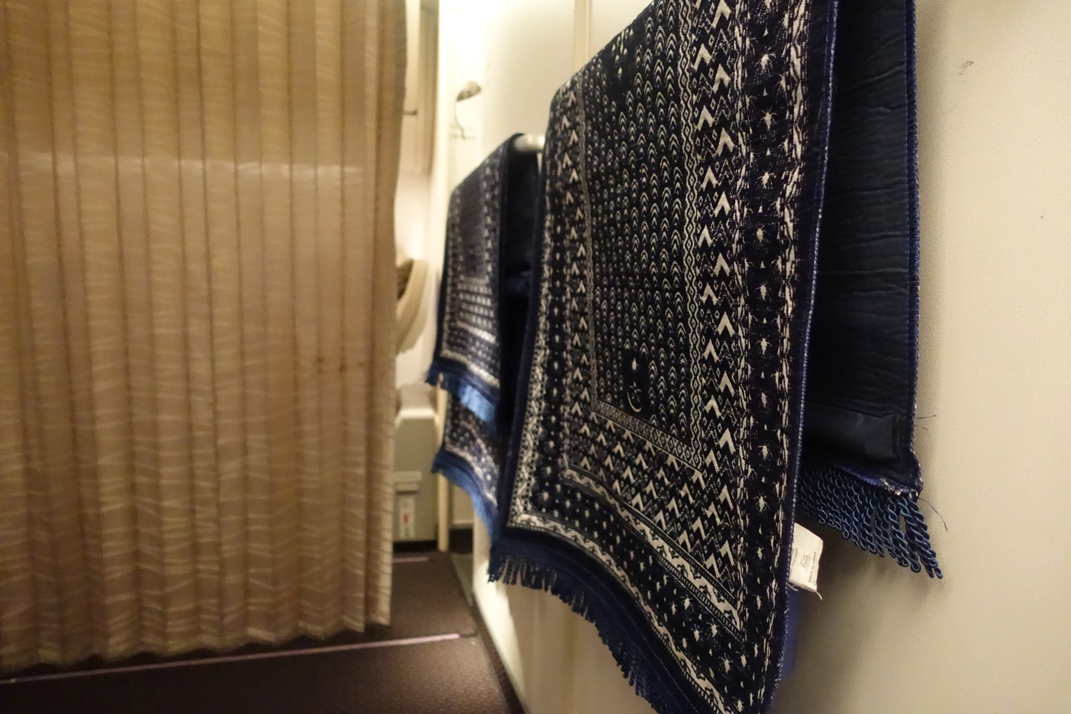a blue and white rugs on a wall