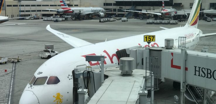 a white airplane at an airport