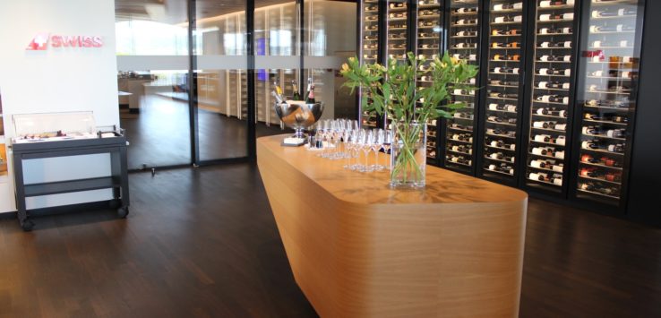 a wine cellar with wine glasses on a table